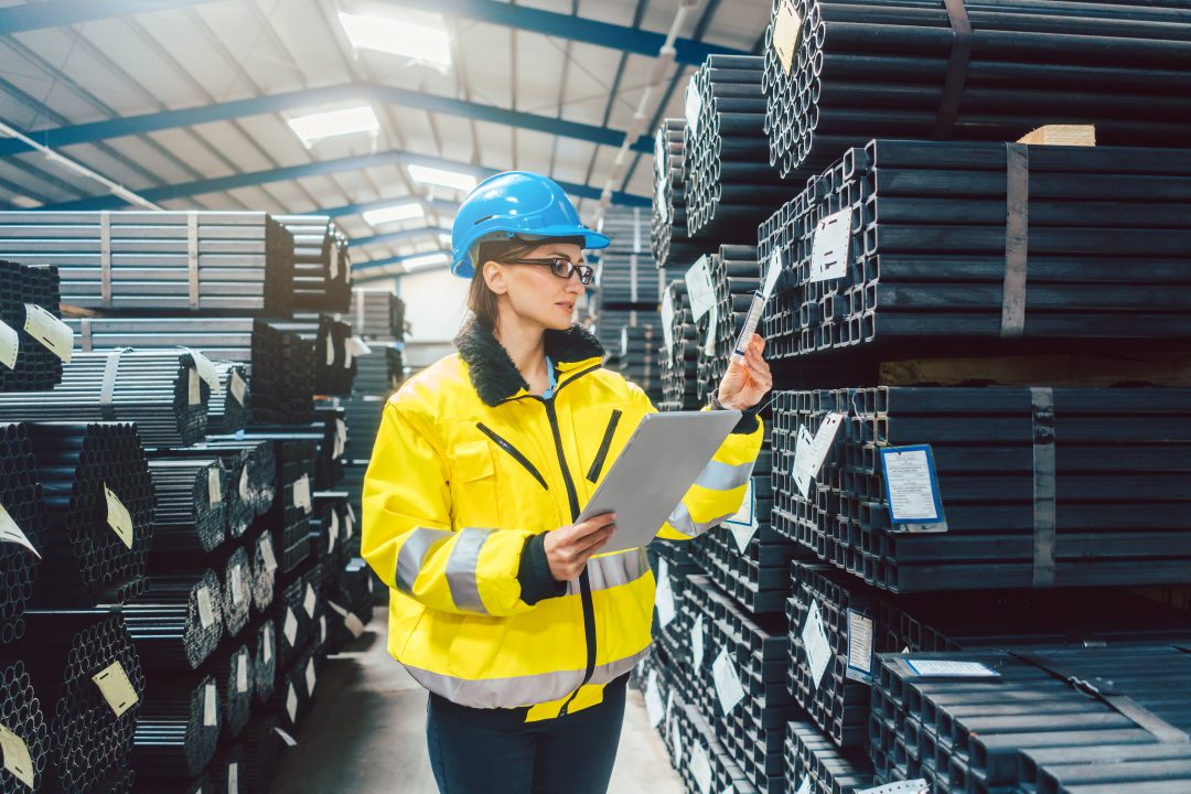 worker checking the inventory in a warehouse